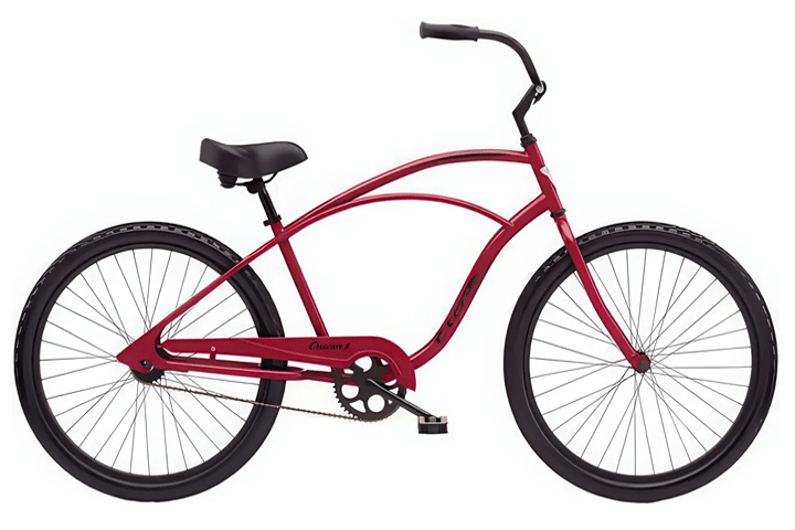 Red cruiser bike with black tires on a white background.